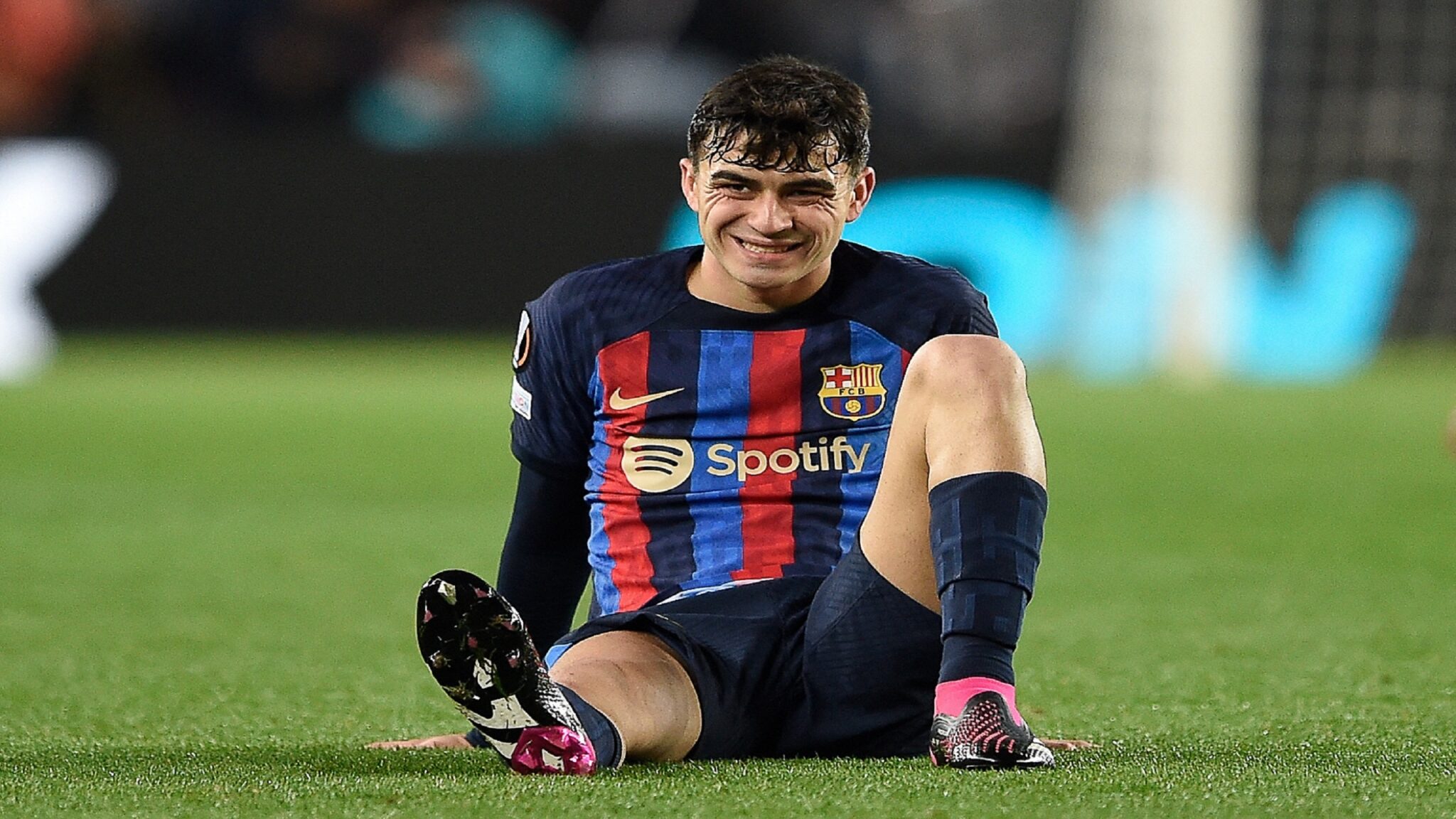 Barcelona's Spanish midfielder Pedri reacts after a fall during the UEFA Europa League round of 32 first-leg football match between FC Barcelona and Manchester United at the Camp Nou stadium in Barcelona, on February 16, 2023. (Photo by Josep LAGO / AFP) (Photo by JOSEP LAGO/AFP via Getty Images)