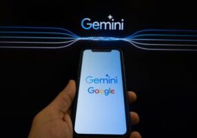 In this photo illustration two different versions of Gemini logo and a Google logo are displayed on a pc screen and a smartphone in L'Aquila, Italy, on February 12th, 2024. Google replaced its AI chatbot "Google Bard" with Gemini.  (Photo by Lorenzo Di Cola/NurPhoto via Getty Images)