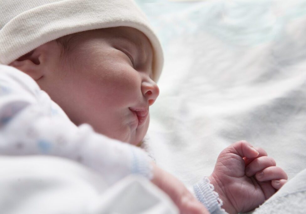 Newborn,Baby,Sleeping,On,Side,Position.,Few,Hours-old,Baby,At